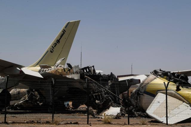 CORRECTION / Heavily damaged aircraft are seen at Khartoum International Airport in Khartoum on April 28, 2026. The civil war in Sudan between the army and the paramilitary Rapid Support Forces has killed tens of thousands of people since April 2023 and displaced more than 12 million people. (Photo by Ebrahim HAMID / AFP) / “The erroneous mention[s] appearing in the metadata of this photo by Ebrahim HAMID has been modified in AFP systems in the following manner: corrects byline to [Ebrahim HAMID] instead of [Khaled DESOUKI]. Please immediately remove the erroneous mention[s] from all your online services and delete it (them) from your servers. If you have been authorized by AFP to distribute it (them) to third parties, please ensure that the same actions are carried out by them. Failure to promptly comply with these instructions will entail liability on your part for any continued or post notification usage. Therefore we thank you very much for all your attention and prompt action. We are sorry for the inconvenience this notification may cause and remain at your disposal for any further information you may require.”