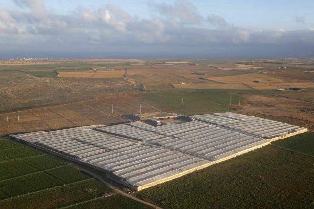 This aerial photograph shows a patch of greenhouse farming in Agadir on May 8, 2026. (Photo by Abdel Majid BZIOUAT / AFP)