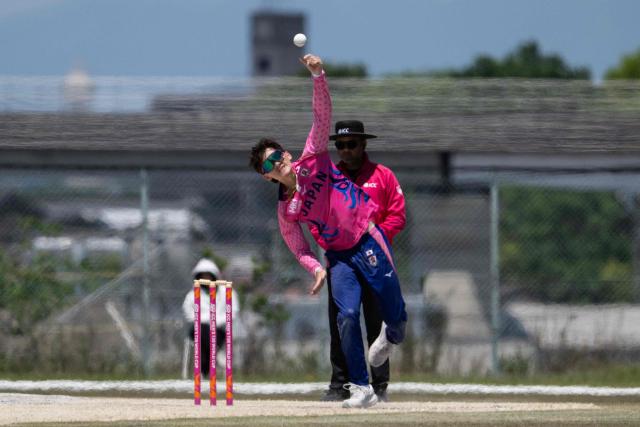 Japan’s Charlie Hinze bowls during the ICC T20 World Cup East Asia-Pacific Qualifier cricket match between Japan and Vanuatu at the Nisshin Cricket Ground at Korogi Sports Park in Nisshin, Aichi Prefecture on May 9, 2026. (Photo by ANDREW CABALLERO-REYNOLDS / AFP)