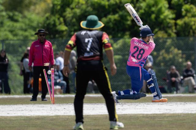 Japan’s Esam Rahman (R) is bowled during the ICC T20 World Cup East Asia-Pacific Qualifier cricket match between Japan and Vanuatu at the Nisshin Cricket Ground at Korogi Sports Park in Nisshin, Aichi Prefecture on May 9, 2026. (Photo by ANDREW CABALLERO-REYNOLDS / AFP)