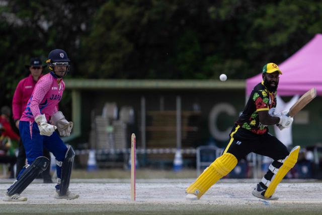 Japan’s Alex Shirai-Patmore (R) looks on as Vanuatu’s Nalin Nipiko plays a shot during their ICC T20 World Cup East Asia-Pacific Qualifier cricket match at the Nisshin Cricket Ground at Korogi Sports Park in Nisshin, Aichi Prefecture on May 9, 2026. (Photo by ANDREW CABALLERO-REYNOLDS / AFP)