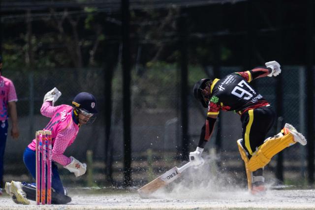 Japan’s Alex Shirai-Patmore (L) misses the ball as Vanuatu’s Junior Kaltapau runs for the crease during their ICC T20 World Cup East Asia-Pacific Qualifier cricket match at the Nisshin Cricket Ground at Korogi Sports Park in Nisshin, Aichi Prefecture on May 9, 2026. (Photo by ANDREW CABALLERO-REYNOLDS / AFP)