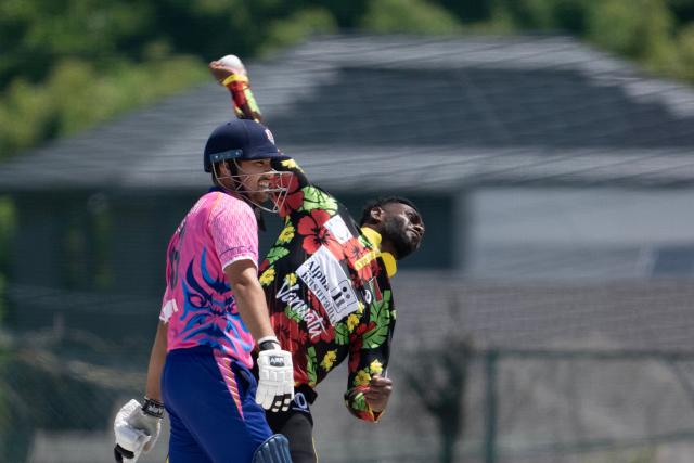 Japan’s Ibrahim Takahashi (L) looks on as Vanuatu’s Josh Rasu bowls during their ICC T20 World Cup East Asia-Pacific Qualifier cricket match at the Nisshin Cricket Ground at Korogi Sports Park in Nisshin, Aichi Prefecture on May 9, 2026. (Photo by ANDREW CABALLERO-REYNOLDS / AFP)