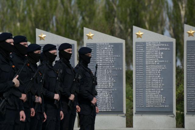 Russian servicemen of the Special Rapid Response Unit (SOBR) attend a ceremony marking the 81st anniversary of the victory over Nazi Germany in World War II at the Savur-Mohyla memorial in the Donetsk region, Russian-controlled Ukraine on May 8, 2026, amid the ongoing Russian-Ukrainian conflict. (Photo by AFP)