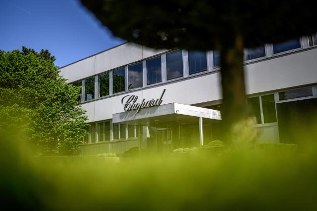 This photograph taken on April 21, 2026 shows the entrance of the headquarters of Swiss manufacturer and retailer of watches, jewellery and accessories Chopard, in Meyrin near Geneva. The Palme d'Or, the top prize at the Cannes Film Festival, takes more than 70 hours of meticulous craftsmanship to produce at Swiss jeweller Chopard's workshops outside Geneva. Since its creation in 1955, the Palme d'Or has constantly evolved. Its current form was conceived in 1998 by Caroline Scheufele, co-president of Chopard. (Photo by Fabrice COFFRINI / AFP)