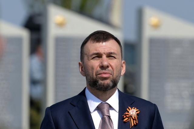 Denis Pushilin, the Moscow-installed head of the Donetsk region of Russian-controlled Ukraine, attends a ceremony marking the 81st anniversary of the victory over Nazi Germany in World War II at the Savur-Mohyla memorial in the Donetsk region, Russian-controlled Ukraine on May 8, 2026, amid the ongoing Russian-Ukrainian conflict. (Photo by AFP)