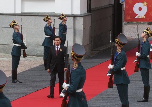 In this pool photograph distributed by the Russian state agency Sputnik, Laotian President Thongloun Sisoulith arrives at the Kremlin ahead of a meeting with Russian President in Moscow on May 9, 2026, the Victory Day. Russia celebrates the 81st anniversary of the Soviet Union's victory over Nazi Germany in World War Two (WWII). (Photo by Sergei KARPUKHIN / POOL / AFP)