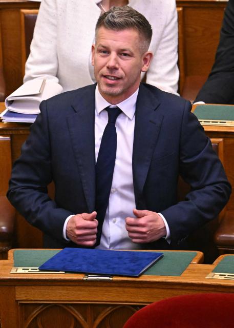 Hungary's incoming Prime Minister Peter Magyar reacts during the inaugural session of the new Parliament and the ceremonial swearing in of representatives in Budapest on May 9, 2026. Hungarian parliament's inaugural session on May 9, 2026, will see a record number of women, accounting for more than a quarter of lawmakers, and more than a hundred deputies new to politics. (Photo by Attila KISBENEDEK / AFP)