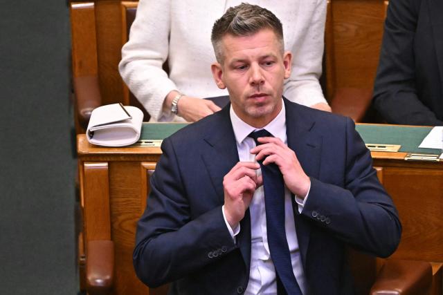 Hungary's incoming Prime Minister Peter Magyar reacts during the inaugural session of the new Parliament and the ceremonial swearing in of representatives in Budapest on May 9, 2026. Hungarian parliament's inaugural session on May 9, 2026, will see a record number of women, accounting for more than a quarter of lawmakers, and more than a hundred deputies new to politics. (Photo by Attila KISBENEDEK / AFP)