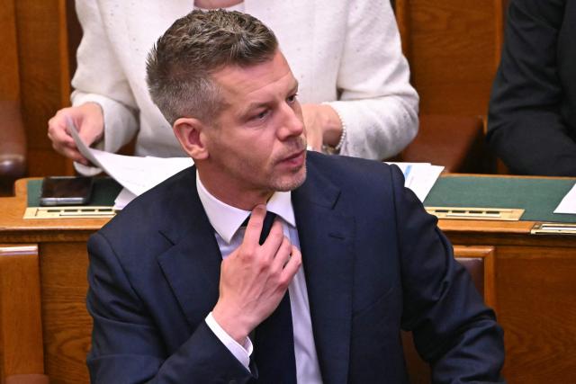 Hungary's incoming Prime Minister Peter Magyar reacts during the inaugural session of the new Parliament and the ceremonial swearing in of representatives in Budapest on May 9, 2026. Hungarian parliament's inaugural session on May 9, 2026, will see a record number of women, accounting for more than a quarter of lawmakers, and more than a hundred deputies new to politics. (Photo by Attila KISBENEDEK / AFP)