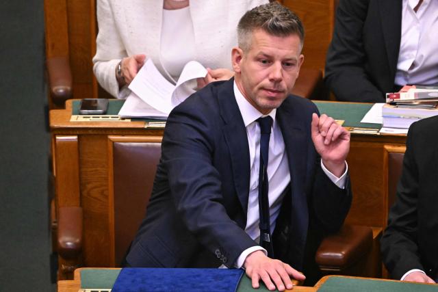 Hungary's incoming Prime Minister Peter Magyar reacts during the inaugural session of the new Parliament and the ceremonial swearing in of representatives in Budapest on May 9, 2026. Hungarian parliament's inaugural session on May 9, 2026, will see a record number of women, accounting for more than a quarter of lawmakers, and more than a hundred deputies new to politics. (Photo by Attila KISBENEDEK / AFP)