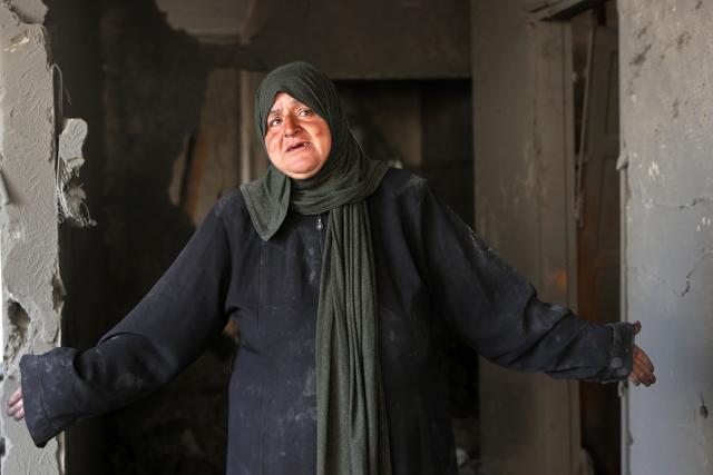 A Palestinian woman weeps while standing inside a destroyed building, a day after of an Israeli strike at the Shati refugee camp (Beach) in Gaza City, on May 9, 2026. Despite an October ceasefire, Gaza remains gripped by daily violence as Israeli strikes continue, with both the military and Hamas accusing one another of violating the truce. (Photo by Omar AL-QATTAA / AFP)