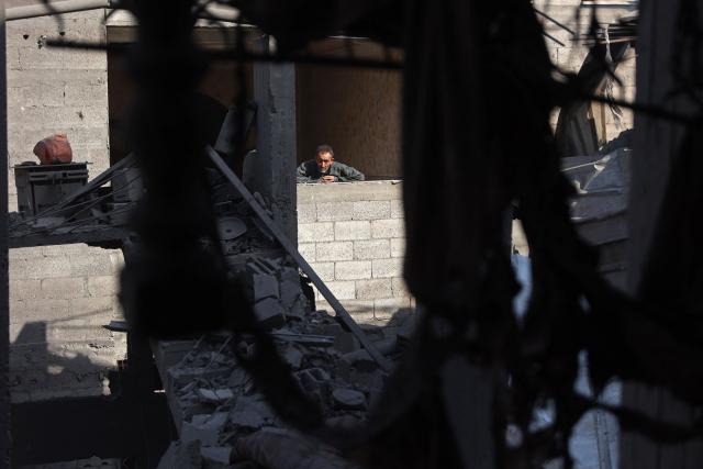 A Palestinian man stands inside a damaged building, a day after of an Israeli strike at the Shati refugee camp (Beach) in Gaza City, on May 9, 2026. Despite an October ceasefire, Gaza remains gripped by daily violence as Israeli strikes continue, with both the military and Hamas accusing one another of violating the truce. (Photo by Omar AL-QATTAA / AFP)
