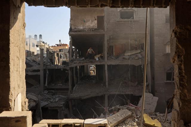 A Palestinian man inspects the site, a day after of an Israeli strike at the Shati refugee camp (Beach) in Gaza City, on May 9, 2026. Despite an October ceasefire, Gaza remains gripped by daily violence as Israeli strikes continue, with both the military and Hamas accusing one another of violating the truce. (Photo by Omar AL-QATTAA / AFP)