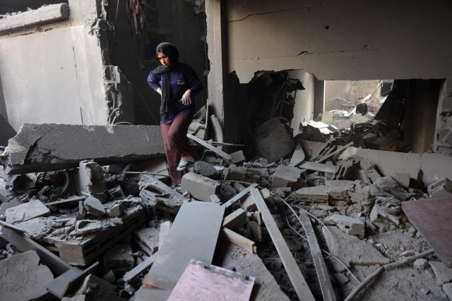 Palestinians inspect the site, a day after of an Israeli strike at the Shati refugee camp (Beach) in Gaza City, on May 9, 2026. Despite an October ceasefire, Gaza remains gripped by daily violence as Israeli strikes continue, with both the military and Hamas accusing one another of violating the truce. (Photo by Omar AL-QATTAA / AFP)