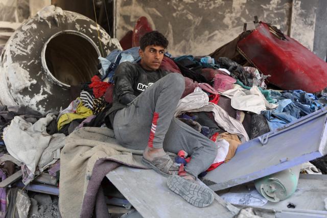 A Palestinian man sits inside a damaged building, a day after of an Israeli strike at the Shati refugee camp (Beach) in Gaza City, on May 9, 2026. Despite an October ceasefire, Gaza remains gripped by daily violence as Israeli strikes continue, with both the military and Hamas accusing one another of violating the truce. (Photo by Omar AL-QATTAA / AFP)