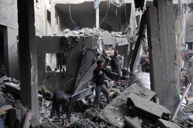 Palestinians inspect the site, a day after of an Israeli strike at the Shati refugee camp (Beach) in Gaza City, on May 9, 2026. Despite an October ceasefire, Gaza remains gripped by daily violence as Israeli strikes continue, with both the military and Hamas accusing one another of violating the truce. (Photo by Omar AL-QATTAA / AFP)