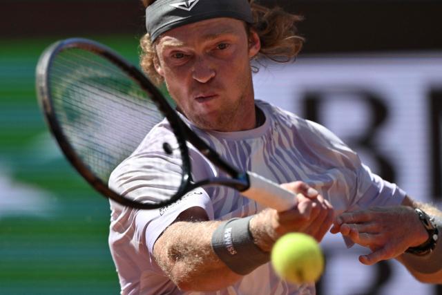 Russia's Andrey Rublev hits a return to Serbia's Miomir Kecmanovic during the ATP Rome Open tennis tournament at Foro Italico in Rome on May 9, 2026. (Photo by Tiziana FABI / AFP)