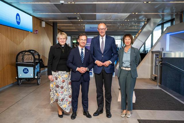 Sweden’s Prime Minister Ulf Kristersson (2nd L) and his wife Birgitta Ed (L) pose with German Chancellor and Chairman of Germany's conservative Christian Democratic Union (CDU) party Friedrich Merz (2nd R) and his wife Charlotte Merz (R) as they arrive to attend Sweden's Moderate party's convention on May 9, 2026 in Stockholm. (Photo by Jonathan NACKSTRAND / AFP)