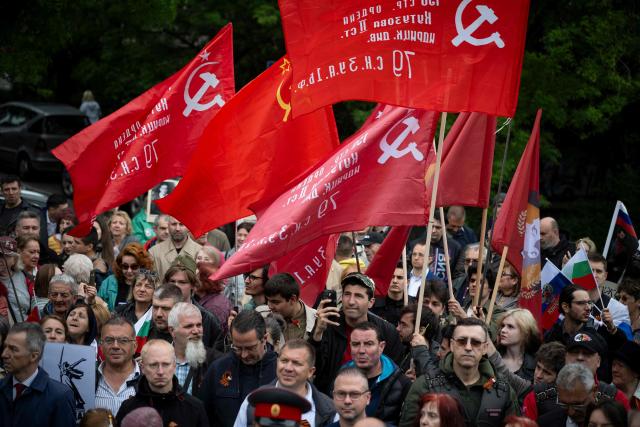 People wave Soviet Union flags during the celebration of the Victory Day, marking the Allied victory against Nazi Germany and the end of World War II in Europe (VE Day), in Sofia, on May 9, 2026. Pro-Russian circles in Bulgaria remain divided over the prospects for improved relations with Russia following Rumen Radev’s assumption of the office of prime minister. (Photo by Nikolay DOYCHINOV / AFP)
