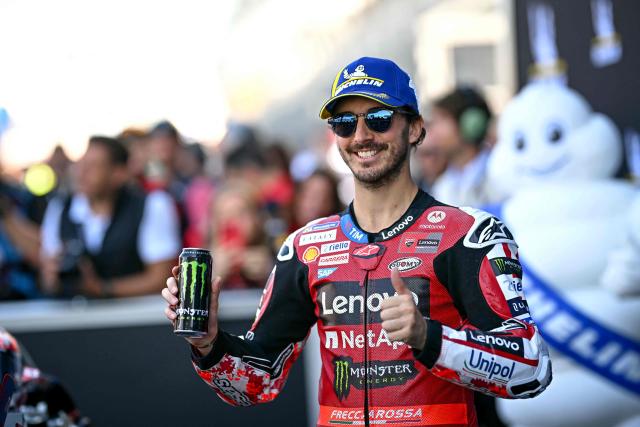 Ducati Lenovo Team's Italian rider Francesco Bagnaia celebrates after setting the fastest time in qualifying to take pole position ahead of the Moto GP Grand Prix of France at Le Mans, northwestern France, on May 9, 2026. (Photo by Loic VENANCE / AFP)