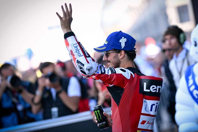 Ducati Lenovo Team's Italian rider Francesco Bagnaia celebrates after setting the fastest time in qualifying to take pole position ahead of the Moto GP Grand Prix of France at Le Mans, northwestern France, on May 9, 2026. (Photo by Loic VENANCE / AFP)