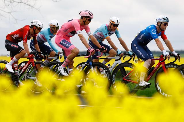 TOPSHOT - Soudal Quick-Step French rider Paul Magnier wearing the overall leader's pink jersey (Maglia Rosa) rides during the 2nd stage of the Giro d'Italia 2026 - Tour of Italy cycling race between Burgas and Veliko Tarnovo, Bulgaria, on May 9, 2026. (Photo by Luca Bettini / AFP)