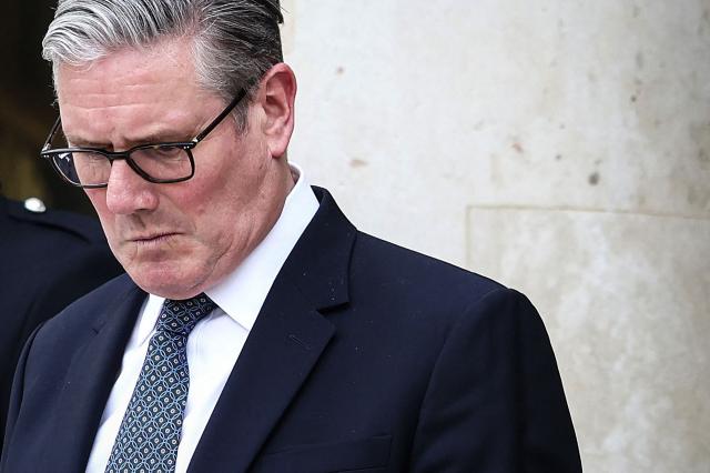 (FILES) Britain's Prime Minister Keir Starmer reacts as he prepares to leave the Elysee Presidential Palace in Paris on April 17, 2026. British Prime Minister Keir Starmer promised on May 9, 2026, he would "listen to voters" after his Labour party received a historic drubbing in local and regional elections. (Photo by Tom Nicholson / POOL / AFP)