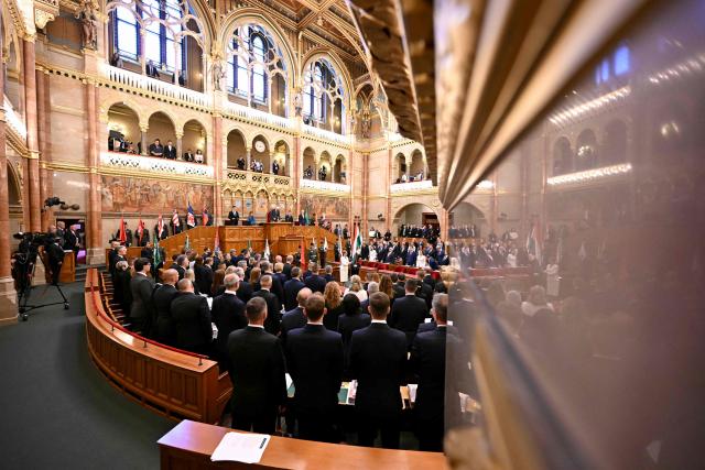 The incoming speaker of the Hungarian parliament Agnes Forsthoffer (C) is sworn in at the Hungarian parliament in Budapest on May 9, 2026. Pro-European conservative Peter Magyar will be officially sworn in as Prime Minister by the Hungarian parliament on May 9, 2026, just under a month after his landslide victory in the parliamentary elections against nationalist Viktor Orban. (Photo by Attila KISBENEDEK / AFP)