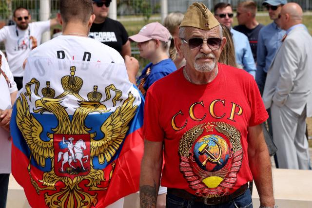 Red Army veterans participate alongside relatives and supporters in a ceremony to commemorate the 81th anniversary of the Victory over Germany in World War II, at the Victory Monument commemorating the Red Army's victory over Nazi Germany, in the Israeli coastal city of Netanya on May 9, 2026. (Photo by JACK GUEZ / AFP)