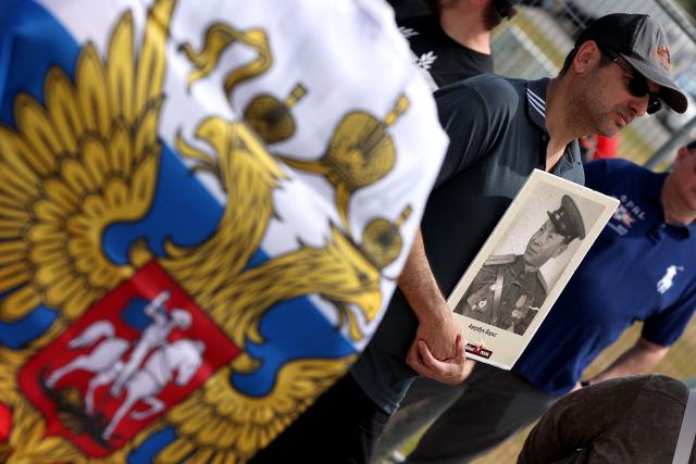 Red Army veterans participate alongside relatives and supporters in a ceremony to commemorate the 81th anniversary of the Victory over Germany in World War II, at the Victory Monument commemorating the Red Army's victory over Nazi Germany, in the Israeli coastal city of Netanya on May 9, 2026. (Photo by JACK GUEZ / AFP)