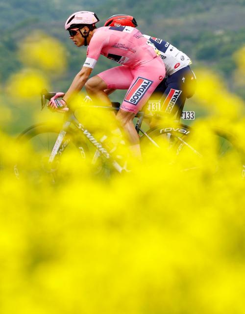 Soudal Quick-Step French rider Paul Magnier wearing the overall leader's pink jersey (Maglia Rosa) rides during the 2nd stage of the Giro d'Italia 2026 - Tour of Italy cycling race between Burgas and Veliko Tarnovo, Bulgaria, on May 9, 2026. (Photo by Luca Bettini / AFP)