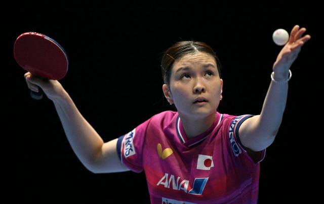 Japan's Honoka Hashimoto plays against Germany's Nina Mittelham during their Women's Teams semifinal match at the ITTF World Table Tennis Championships in Wembley Arena, west London on May 9, 2026. (Photo by Glyn KIRK / AFP)
