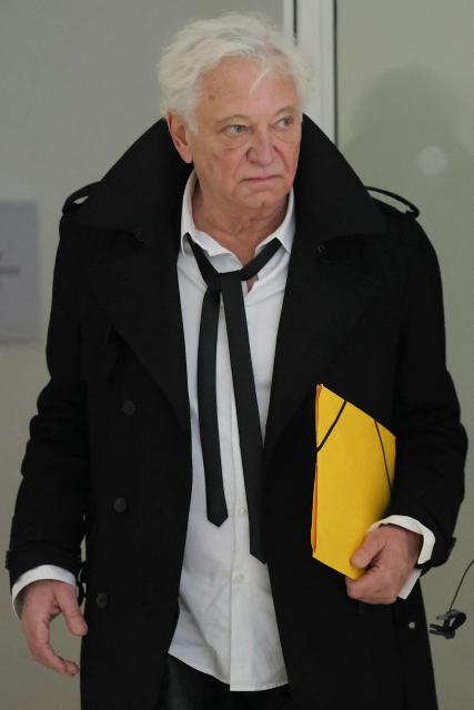 (FILES) Radio and TV host Laurent Boyer arrives for his trial on charges of domestic violence and harassment at the Tribunal Judiciaire courthouse in Paris on March 30, 2026. The Paris court will deliver on May 11, 2026 the verdict for the French presenter Laurent Boyer for domestic violence and invasion of privacy committed against his ex-partner as an eight-month suspended prison sentence was requested for him on March 30, 2026. (Photo by Thomas SAMSON / AFP)