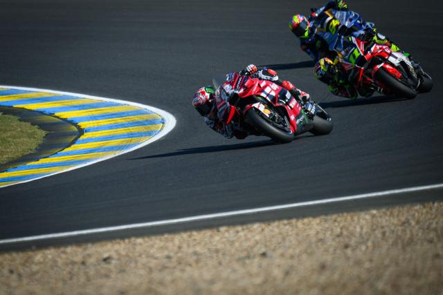 Ducati Lenovo Team's Italian rider Francesco Bagnaia (L) corners during the qualifying session of the Moto GP Grand Prix of France at Le Mans, northwestern France, on May 9, 2026. The Ducati Lenovo Team Italian rider qualified in Pole Position. (Photo by Loic VENANCE / AFP)