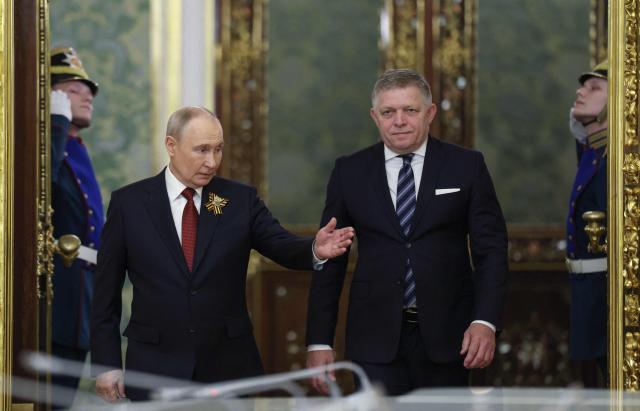 Russian President Vladimir Putin and Slovak Prime Minister Robert Fico attend a meeting in Moscow on May 9, 2026. (Photo by Ramil Sitdikov / POOL / AFP)