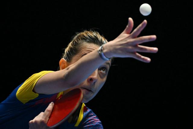 Romania's Elizabeta Samara serves against China's Sun Yingsha during their Women's Teams semi-final match at the ITTF World Table Tennis Championships in Wembley Arena, west London on May 9, 2026. (Photo by Glyn KIRK / AFP)