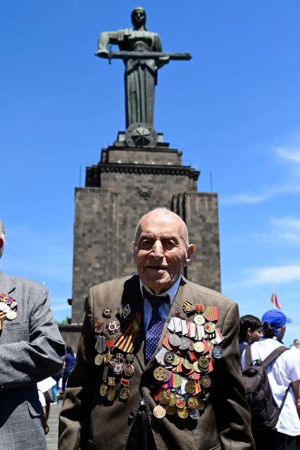 World War Two veteran Nerses Simonyan, 102, attends a ceremony marking the 81st anniversary of the victory over Nazi Germany in World War II, in Yerevan on May 9, 2026. (Photo by KAREN MINASYAN / AFP)