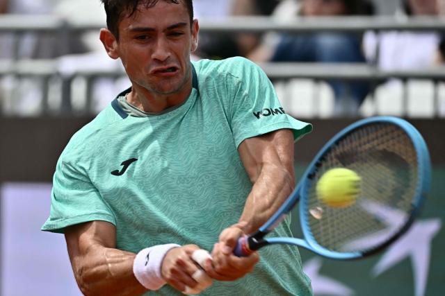 Argentine's Mariano Navone hits a return to Canada's Felix Auger Aliassime during the ATP Rome Open tennis tournament at Foro Italico in Rome on May 9, 2026. (Photo by Filippo MONTEFORTE / AFP)