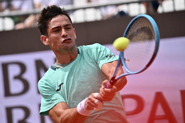 Argentine's Mariano Navone hits a return to Canada's Felix Auger Aliassime during the ATP Rome Open tennis tournament at Foro Italico in Rome on May 9, 2026. (Photo by Filippo MONTEFORTE / AFP)