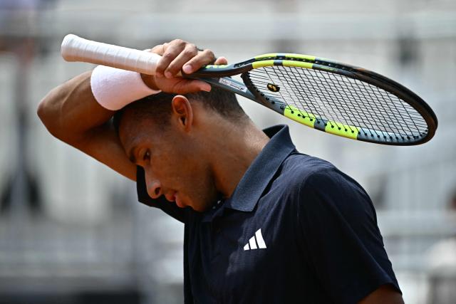 Canada's Felix Auger Aliassime reacts during his match against Argentine's Mariano Navone during the ATP Rome Open tennis tournament at Foro Italico in Rome on May 9, 2026. (Photo by Filippo MONTEFORTE / AFP)
