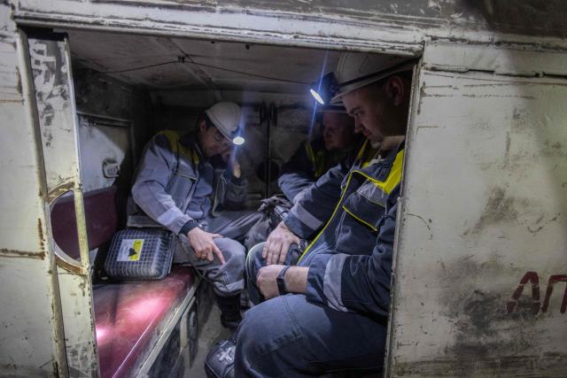Ukrainian miners ride in a railway carriage at a coal mine operated by Ukrainian energy provider DTEK at an undisclosed location in the Dnipropetrovsk region on May 5, 2026, amid the Russian invasion of Ukraine. (Photo by Serhii Okunev / AFP)