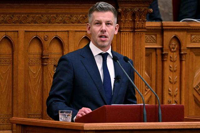 Hungary's incoming Prime Minister Peter Magyar delivers a speech during his swearing-in ceremony at the Hungarian parliament in Budapest on May 9, 2026. Pro-European conservative Peter Magyar will be officially sworn in as Prime Minister by the Hungarian parliament on May 9, 2026, just under a month after his landslide victory in the parliamentary elections against nationalist Viktor Orban. (Photo by Attila KISBENEDEK / AFP)