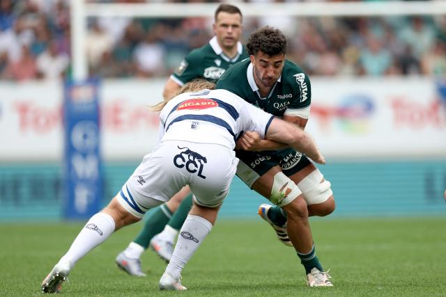 Pau's French back row Sacha Zegueur (R) is tackled by Castres' Australian lock Thomas Staniforth (L) during the French Top14 rugby union match between Section Paloise (Pau) and Castres at the Hameau Stadium in Pau, south-western France, on May 9, 2026. (Photo by ROMAIN PERROCHEAU / AFP)