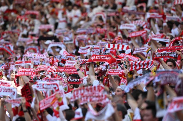 Stuttgart's fans cheer their team and hold up their scarves prior to the German first division Bundesliga football match between VfB Stuttgart and Bayer 04 Leverkusen in Stuttgart, southwestern Germany on May 9, 2026. (Photo by THOMAS KIENZLE / AFP) / DFL REGULATIONS PROHIBIT ANY USE OF PHOTOGRAPHS AS IMAGE SEQUENCES AND/OR QUASI-VIDEO