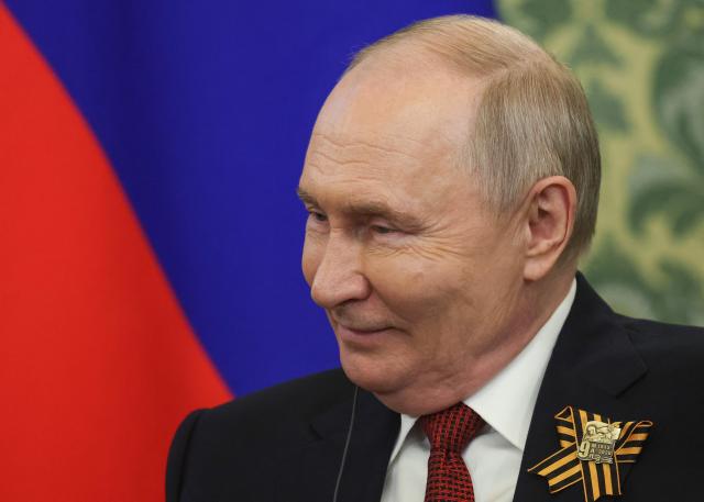 Russia's President Vladimir Putin attends a meeting with Malaysia's King Sultan Ibrahim (not pictured) at the Kremlin in Moscow on May 9, 2026. (Photo by MAXIM SHIPENKOV / POOL / AFP)