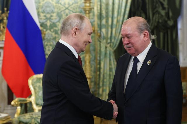 Russia's President Vladimir Putin and Malaysia's King Sultan Ibrahim hold a meeting at the Kremlin in Moscow on May 9, 2026. (Photo by MAXIM SHIPENKOV / POOL / AFP)
