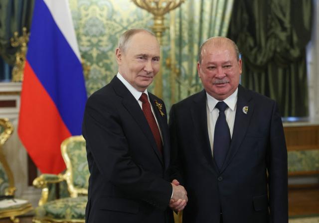 Russia's President Vladimir Putin and Malaysia's King Sultan Ibrahim hold a meeting at the Kremlin in Moscow on May 9, 2026. (Photo by MAXIM SHIPENKOV / POOL / AFP)