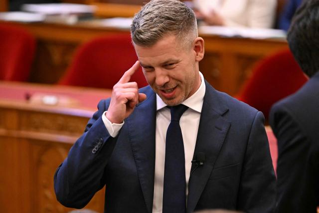 Hungary's incoming Prime Minister Peter Magyar gestures at the Hungarian parliament in Budapest on May 9, 2026. Pro-European conservative Peter Magyar will be officially sworn in as Prime Minister by the Hungarian parliament on May 9, 2026, just under a month after his landslide victory in the parliamentary elections against nationalist Viktor Orban. (Photo by Attila KISBENEDEK / AFP)