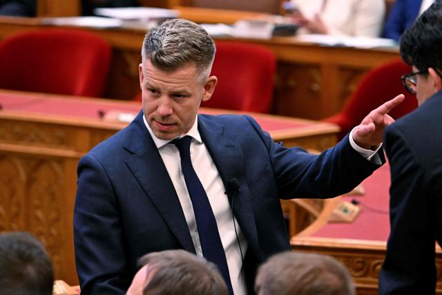 Hungary's incoming Prime Minister Peter Magyar gestures at the Hungarian parliament in Budapest on May 9, 2026. Pro-European conservative Peter Magyar will be officially sworn in as Prime Minister by the Hungarian parliament on May 9, 2026, just under a month after his landslide victory in the parliamentary elections against nationalist Viktor Orban. (Photo by Attila KISBENEDEK / AFP)